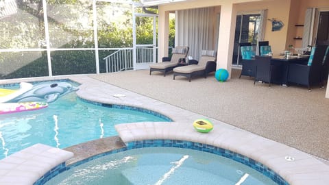inviting Patio with heated pool and user friendly Jacuzzi