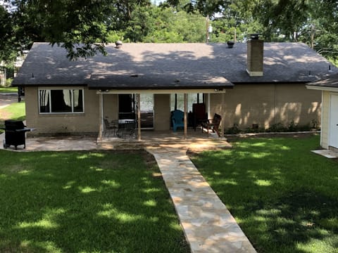 Backyard shaded by huge pecan trees