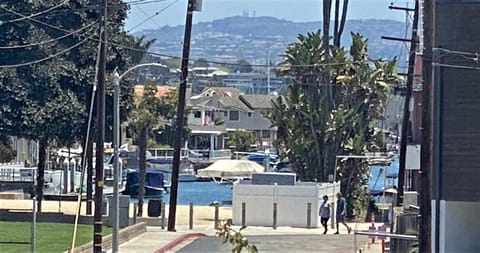 Peek a boo view of Newport Bay from living room and dining table of upper unit.