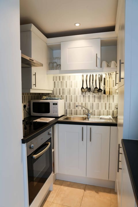 Compact with all you need. A washing machine and fridge in here too!