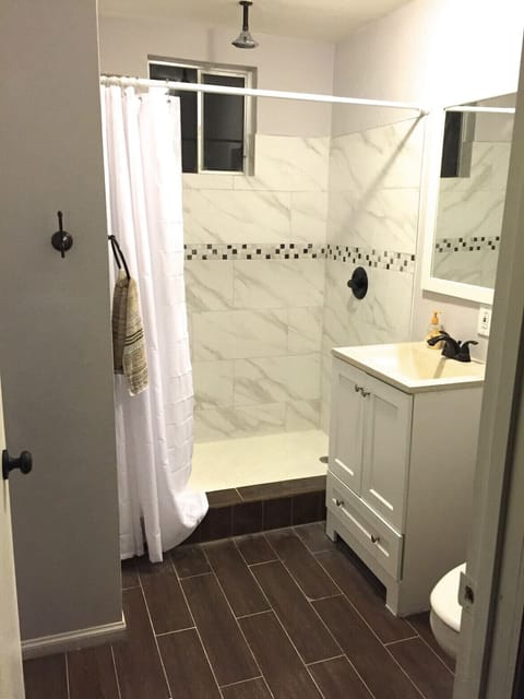 Combined shower/tub, hair dryer, towels, soap