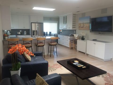 Comfy living room overlooking the spacious, open kitchen.