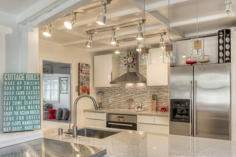 Completely new kitchen with microwave, oven, dishwasher,refrigerator with ice maker. Quartz counter tops through out-stunning! Well stocked with pots, pans, dishes etc. Everything to make you feel at home.