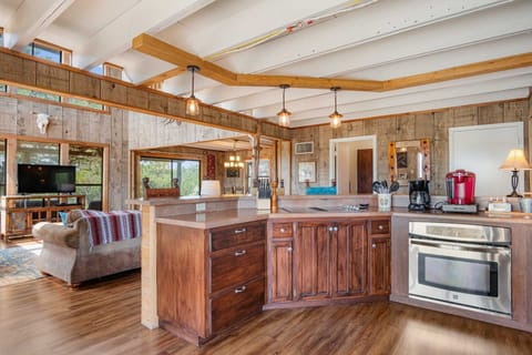 A fully-equipped kitchen with an open layout, perfect for entertaining and enjoying the view."