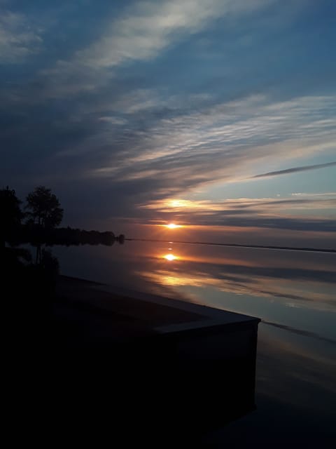 The sunrise over the lake from the lake house deck or dock is beautiful.