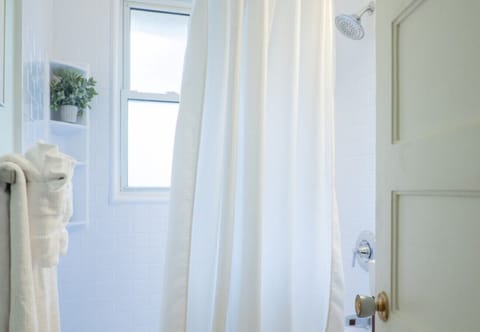 Bathtub, hair dryer, towels