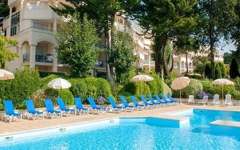 Outdoor pool, a heated pool, sun loungers