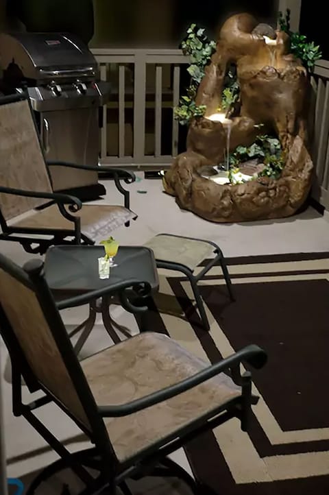 Enjoy a drink, watch a sunset on the balcony with lighted waterfall and gas BBQ