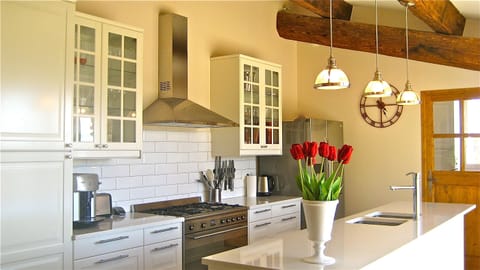 Kitchen. Laundry/office, plus a 3rd WC through wooden door shown in photo.