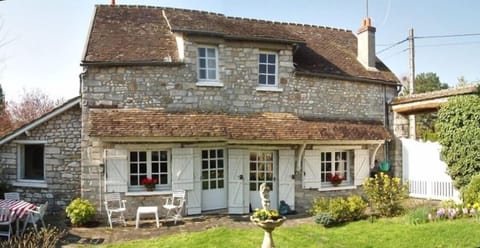 Outside view with patio and enclosed garden