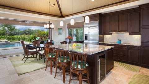 Gourmet kitchen with large center island provides additional seating
