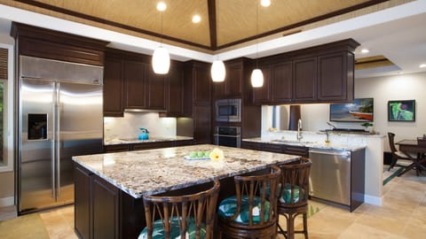 Gourmet kitchen provides plenty of space for providing delicious island inspired meals