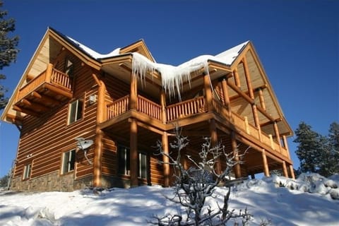 Exterior rear view lower level, large deck on main level, 3rd level loft & deck