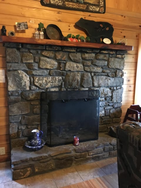Fireplace, made by locally retrieved rock and   built by a local craftsman.