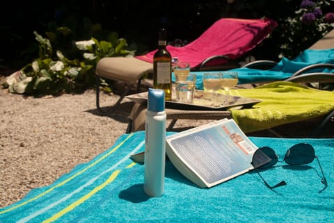 The sun terrace at the rear of the property close to the pool