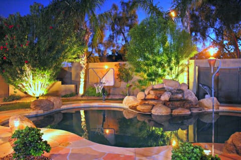 Relax in your private,  fenced in heated pool with a waterfall!