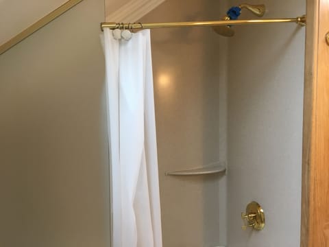 Combined shower/tub, hair dryer, towels, soap