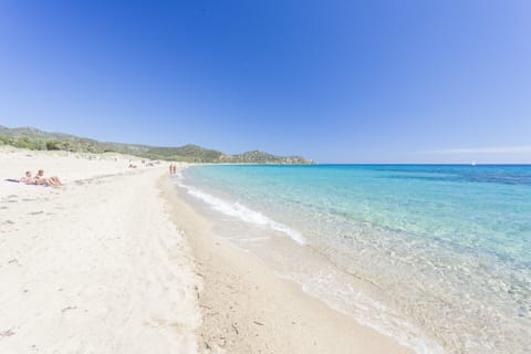 On the beach, sun loungers, beach towels