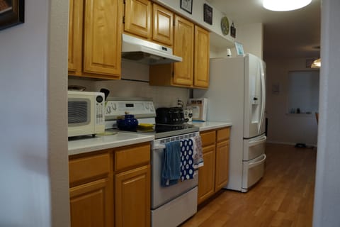 Fully stocked kitchen with all the pots, pans and spices you might need.