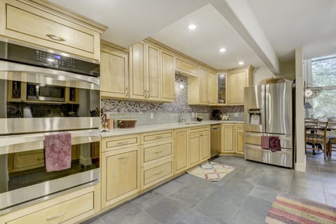 Spacious gourmet kitchen with French-door refrigerator, double ovens, dishwashe