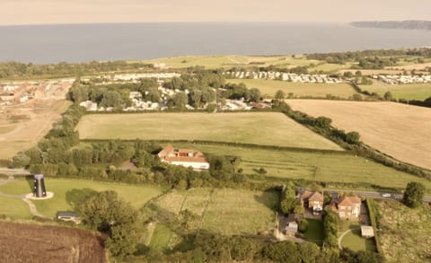 Mill Farm is the middle property to the right of the windmill