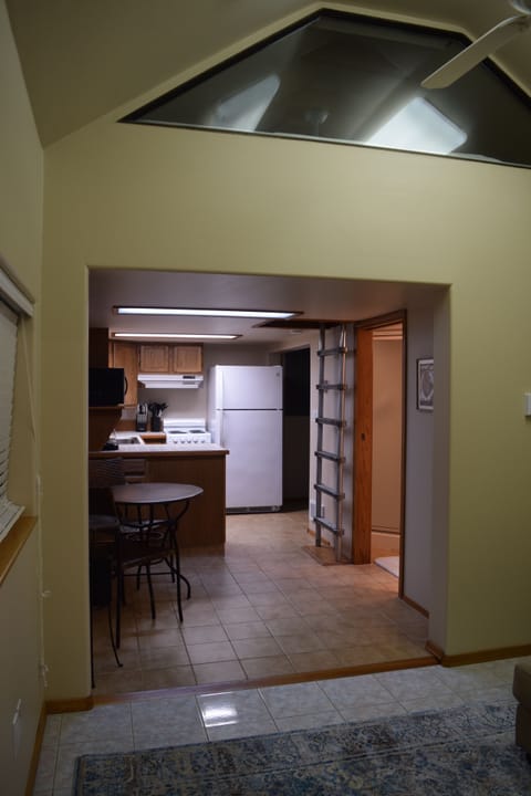 Back of "cabin" with full kitchenette and access to kids loft