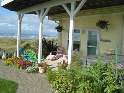 Entrance to the Beach Bum Inn. Showing covered patio, hot tub, seating area.