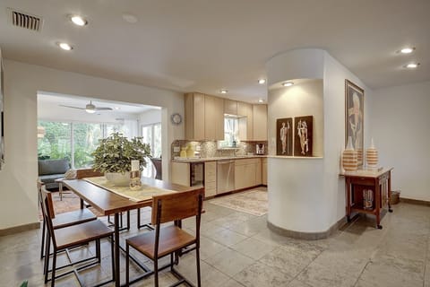 open and bright with stone floors and granite countertops