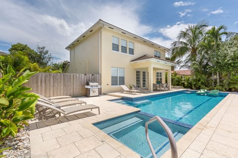 Home on the river with 42 ft solar heated salt water lap pool and spa