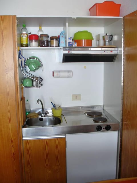 Fridge, stovetop, coffee/tea maker, cookware/dishes/utensils