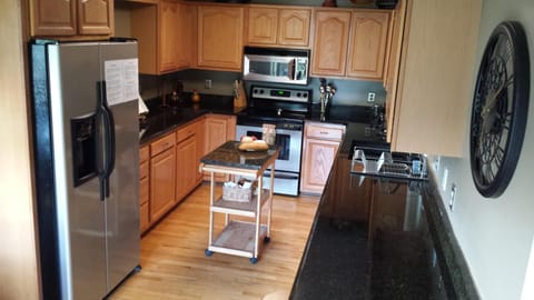 Granite counter kitchen includes many useful appliances. Kuerig coffee maker.