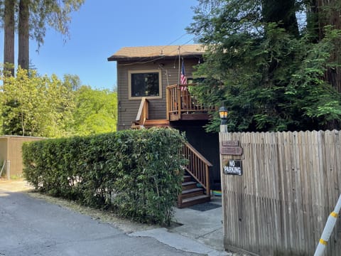 Front of house, surrounded by Redwood Trees.