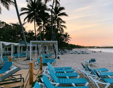 On the beach, sun loungers, beach towels