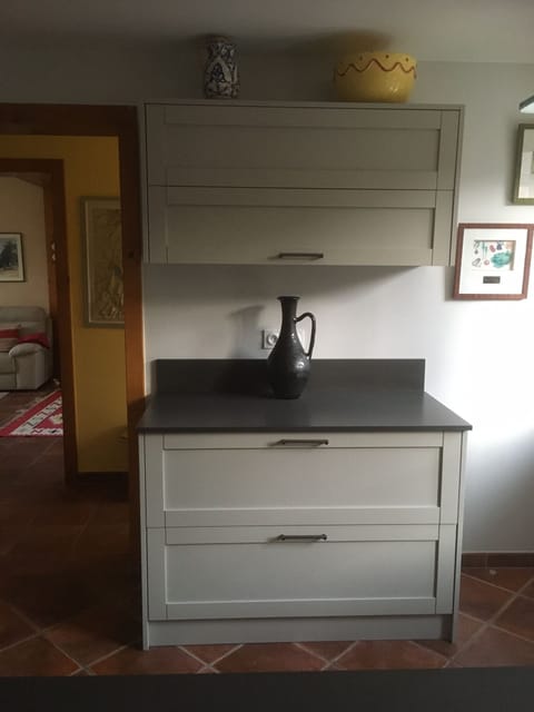 Kitchen, with sitting room in the background