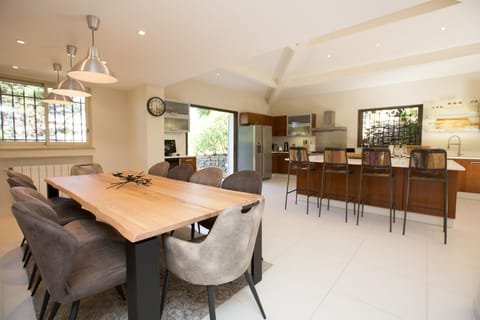 Italian-made Devina Nais solid dining table for 10. Nespresso and wine fridge.