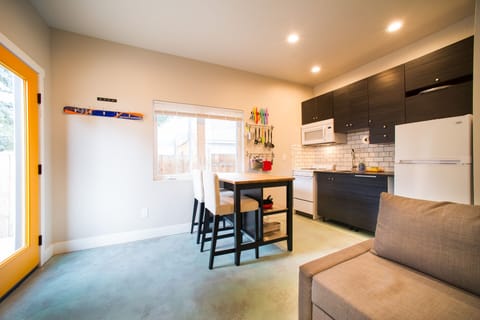 Island in kitchen makes for a nice place to eat, work or study