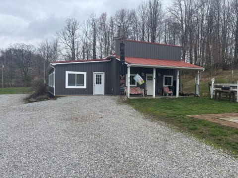 New siding, an enclosed porch and you can almost see the fire pit on the side.