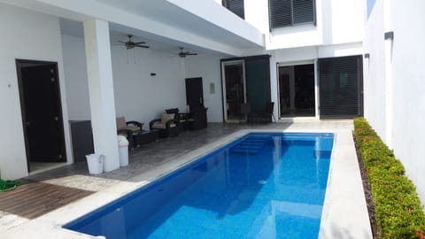 Private and heated 270 square feet pool,  terrace with dining and seating set.