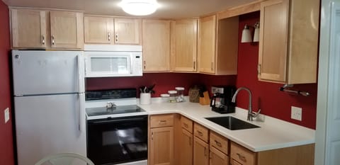 Remodeled, enlarged kitchen. New cabinets, countertop, fridge, microwave, etc