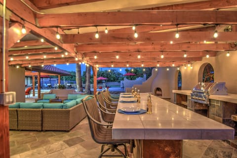 Backyard has a Bar, Fireplace, Lounge Area, Full Kitchen & Much More