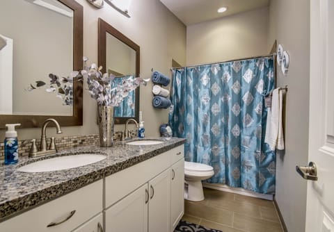 Large Bathroom off the Family Room with Double-Sinks and Tub/Shower Combo