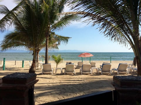 On the beach, sun loungers, beach towels