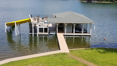 Pier with 2 floors, eating area, slide, and boat access.