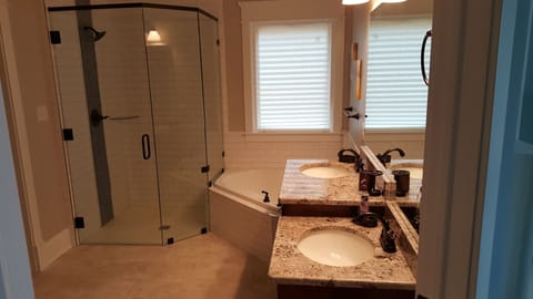 1st floor master bathroom with roll-in shower and roll-under sink.
