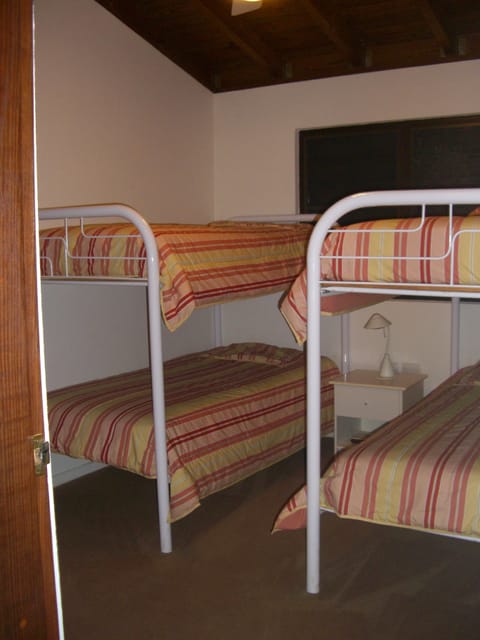 Bunk beds bedroom with a/c and TV.