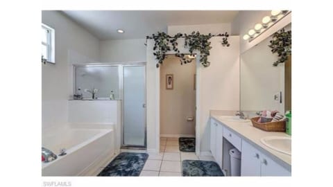 Combined shower/tub, hair dryer, towels, soap