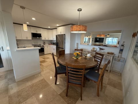 Dining Area with Kitchen behind