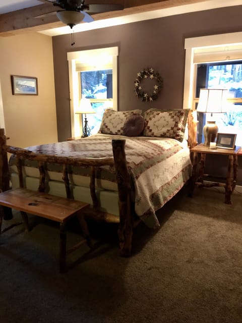 Master bedroom has log queen bed. There is plenty of room...