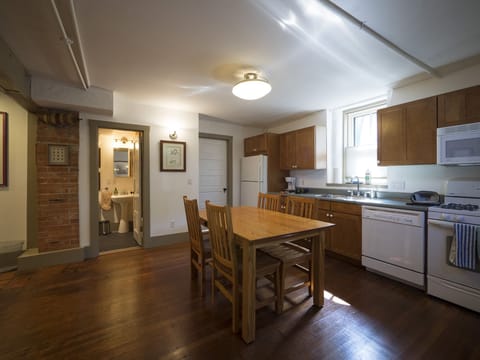 View of kitchen, with bath just off the area.