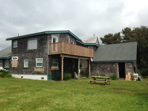 Cabin located on a double lot with outdoor firepit.